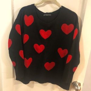 Black sweater with red hearts